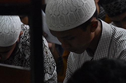 kid reading Quran