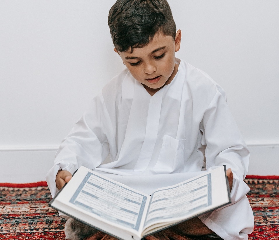 muslim boy reading quran